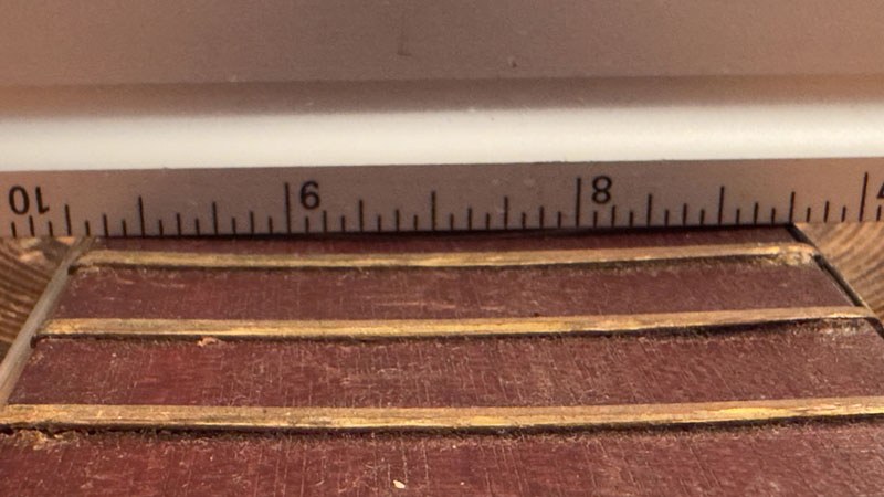 The concave fretboard was beyond the scope of this repair budget.