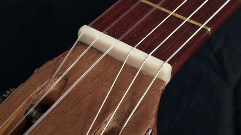 New hand-carved bone nut installed.
