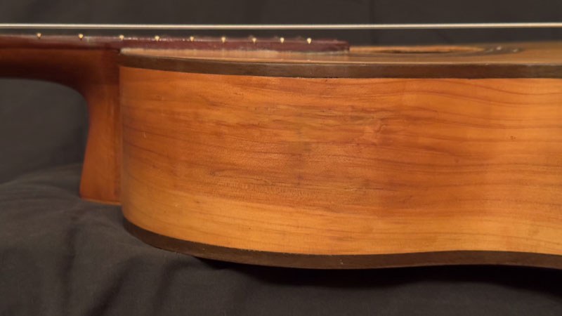 Repaired hole with simulated woodgrain and additional clear coat.